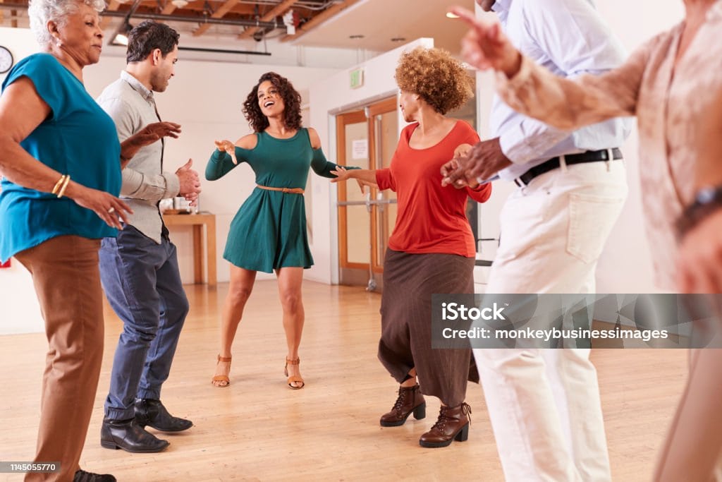 People Attending Dance Class In Community Center