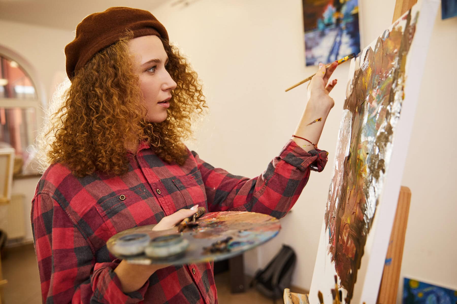 Profile Of Curly Artist During Her Work