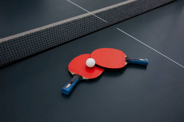 Red Rackets And Ping Pong Ball For Table Tennis.