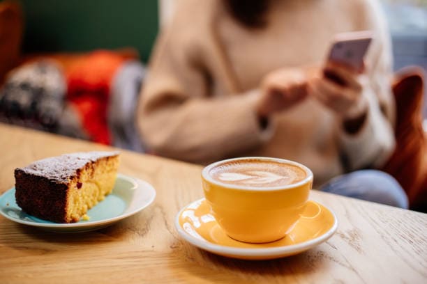 Coffee Latte And Orange Cake On Table